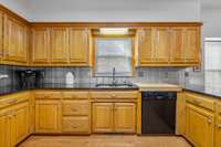 Lots of storage, cabinets and prep space in this kitchen!