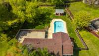 A park like setting with a large lot, herb garden, and salt water pool