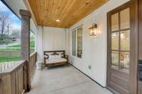 Pinch me perfect front porch with tongue and grove wood ceiling and swing custom bed