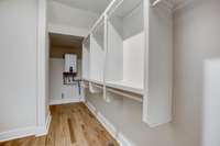 Walk in double closet offers an abundance of storage space