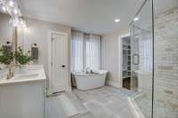 Double vanity, soaking tub, European lighting/plumbing fixtures and walk in shower.