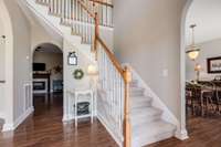 Alternate view of home's front entry hall.  Carpeted steps and second floor flooring all recently replaced.  Notice the freshly painted, neutral walls as well.