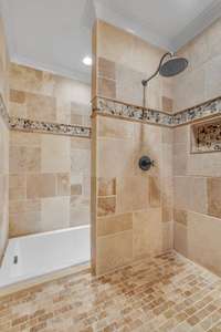 The primary bathroom presents a unique bathing experience, featuring a built-in garden tub adjacent to the spacious walk-in shower, offering both relaxation and luxury. 2491 Taylor Ln  Eagleville, TN 37060