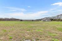 This listing boasts 14 acres of stunning, flat land located in Eagleville, TN, offering ample space for pets, farm activities, and various other pursuits! 2491 Taylor Ln  Eagleville, TN 37060