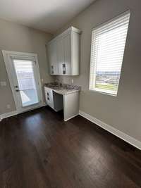 wet bar area just inside door to rooftop deck