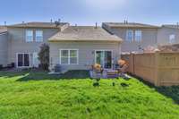 Rear view of the property. Notice the neighbors have fully enclosed their area.