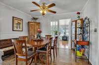 Enhanced by a ceiling fan, crown molding, and wainscoting, the atmosphere is inviting, perfect for enjoying meals or leisurely moments throughout the day.1833 Porterfield Rd Readyville, TN 37149