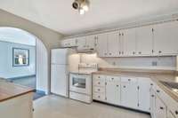 Gracious kitchen with tons of cabinets and counters