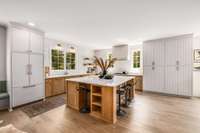 Built in paneled fridge. Custom cabinets and dining banquette