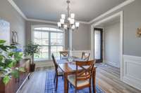 Formal dining room with beautiful wainscoting