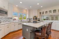 Updated kitchen with quartz counters, Bosch Double Oven, Thermador cooktop and more.