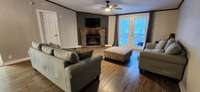 Very roomy great room with wood burning fireplace