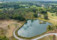 4387 Barfield Crescent Rd - Pond with driveway to building pad