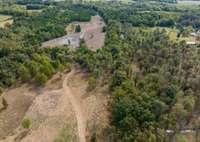 Building Pad and dirt road to back property with 2nd pond