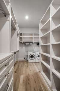 Walk-in closet with laundry.