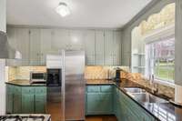 Kitchen w/Stainless Appliances & Granite.