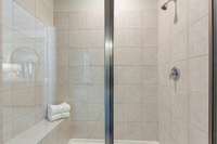 Tile surround shower with bench seat