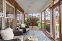 Screen porch with recessed lighting and decorative lighting; TREX deck flooring for low maintenance