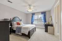 Upstairs bedroom with bathroom; carpet and large closet with storage;