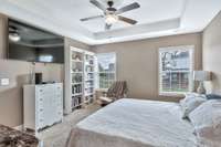 Two windows for plenty of light and custom book shelves