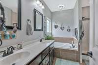 Primary suite bath has - Double vanities and separate tub and shower