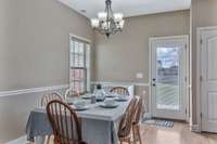 Well lit eat-in kitchen area that will accommodate a large table