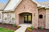 Front porch with double glass doors for more light into your home.