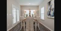 Stock photo of breakfast area which leads out to nice covered back porch