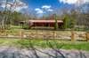 Wood fence has additional wire for animal security