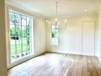 Formal dining room with "hidden" door to the working pantry