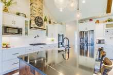 Stacked stone vent hood matches the fireplace.