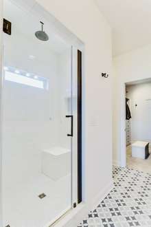 Tiled large shower in the owner's suite bathroom
