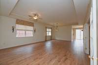 newer flooring and blinds in great room and dining room