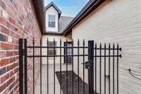 A gated courtyard welcomes you into the home.