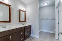 A double vanity and lots of cabinets space provide ample space!