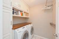 laundry room with built in cabinets