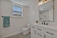 Large full bathroom located downstairs.