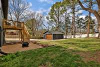 A view of the back yard. The additional back patio has access from the downstairs bedroom. Great place to hang some string lights and add a few patio chairs.