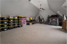 LARGE BONUS ROOM OVER THE THREE CAR GARAGE WITH VAULTED CEILING