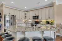 This beautiful kitchen is a chefs dream with tons of prep space. Beautiful cabinets, and pull outs in most of the lower cabinets.