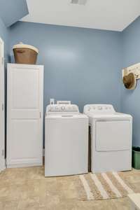 Main floor laundry has a large storage closet as well.  The washer and dryer do not remain with the home.