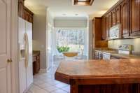 Kitchen with breakfast nook and desk area