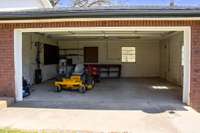 Garage in "old" part of home with electric garage door opener. Perfect for shop or storing lawn equipment
