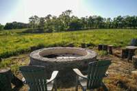 This stone fire pit is the perfect gathering place - sitting on a hill overlooking the rolling land.