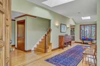 The entryway skylights and stained glass window are a light and bright greeting.