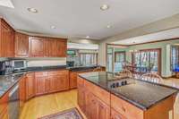 Large kitchen island with views all the way out the back yard. Large, walk-in pantry not pictured.