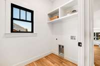 Laundry room with shelving.