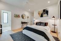 Ensuite guest room with double sinks and zero entry shower.