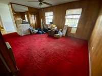 Dining room with hardwood under carpet