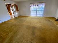 Living Room with Hardwood under carpet